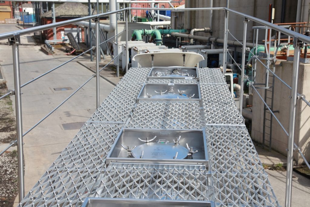 Catwalk with twin ground level operated handrails